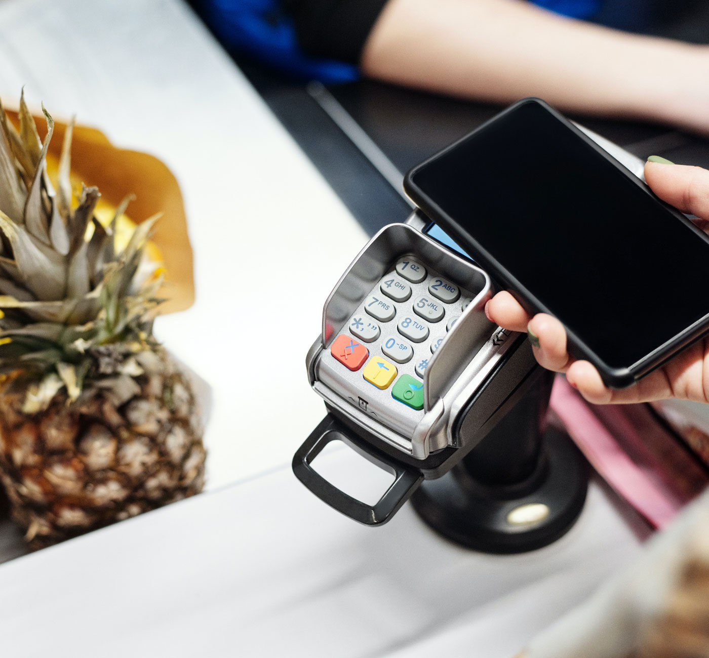 Customer making contactless payment using YELL at a store