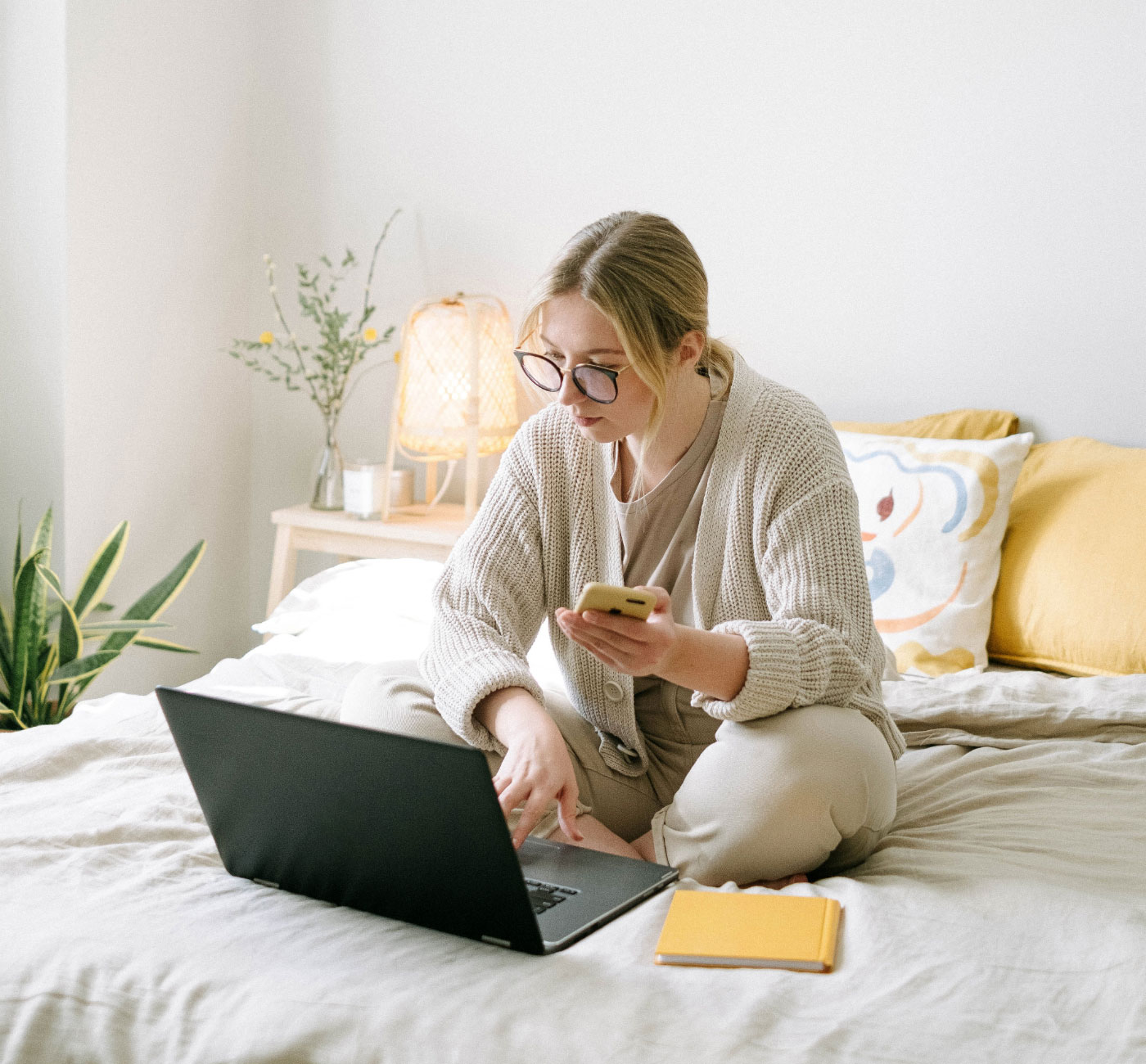 Woman paying bills with YELL via QR code and manual invoice entry